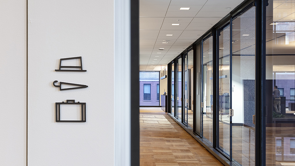 A hallway with glass doors.